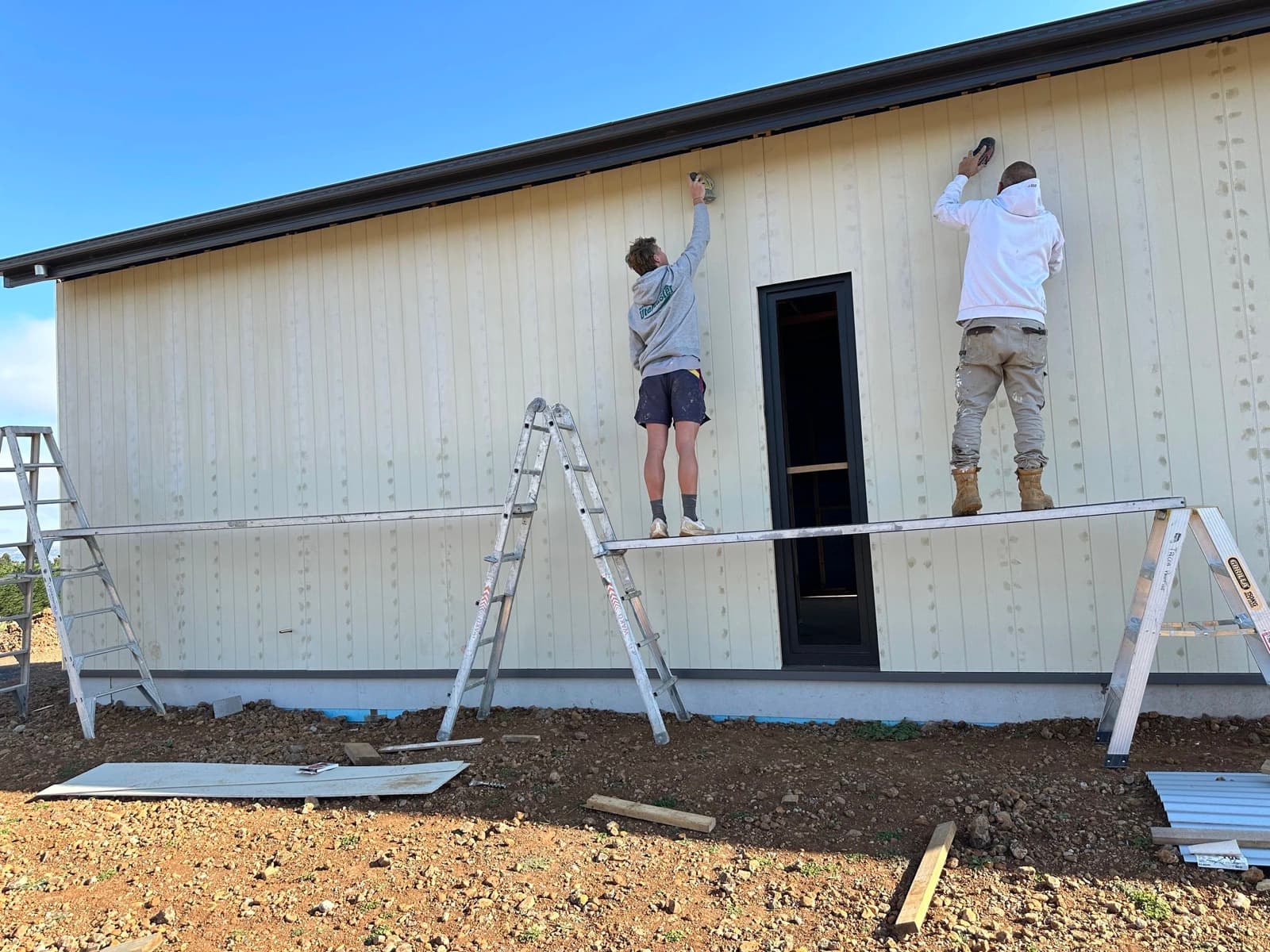 Tricoat crew at work cutting in and rolling a Melbourne home interior