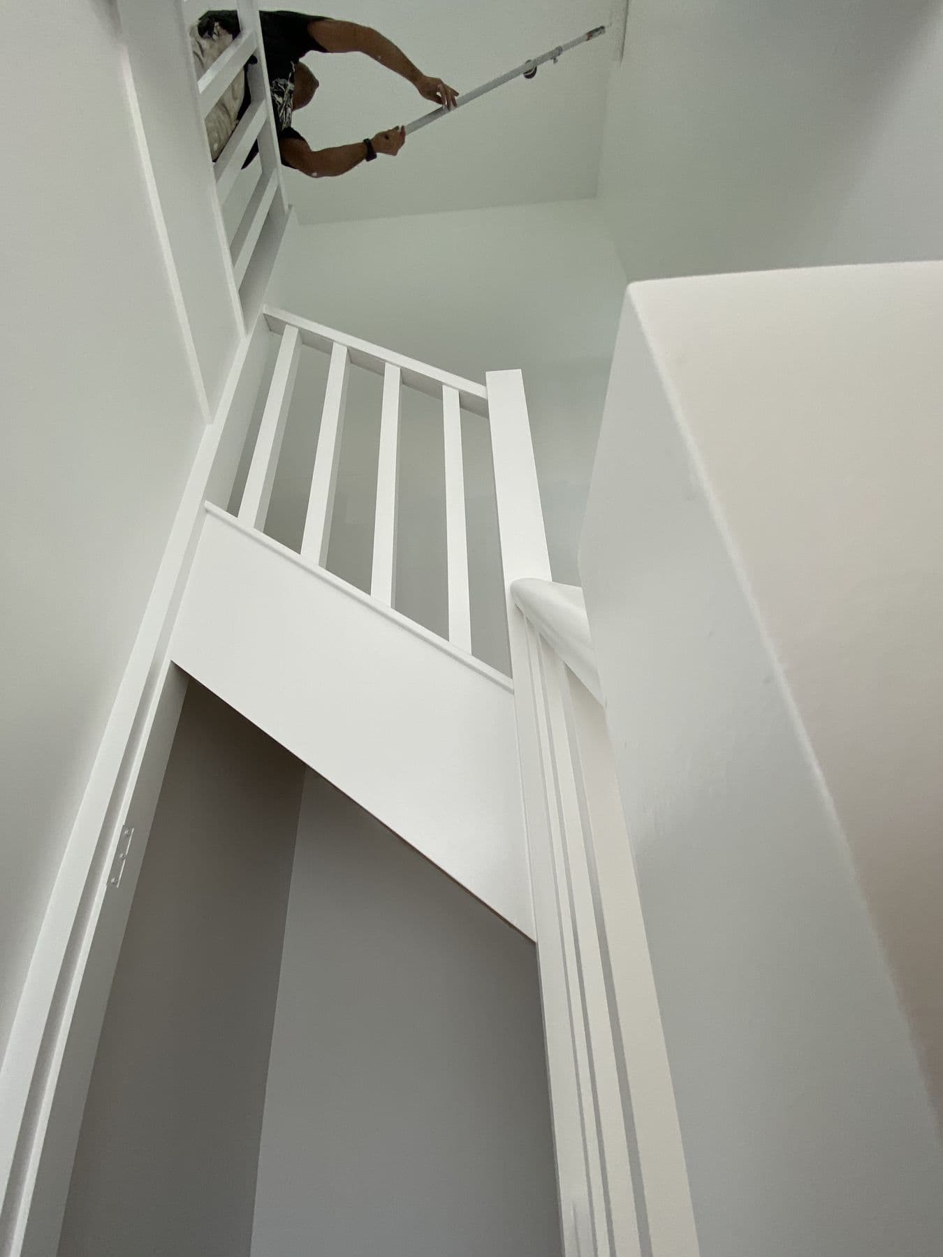 White modern staircase with a clean painted balustrade